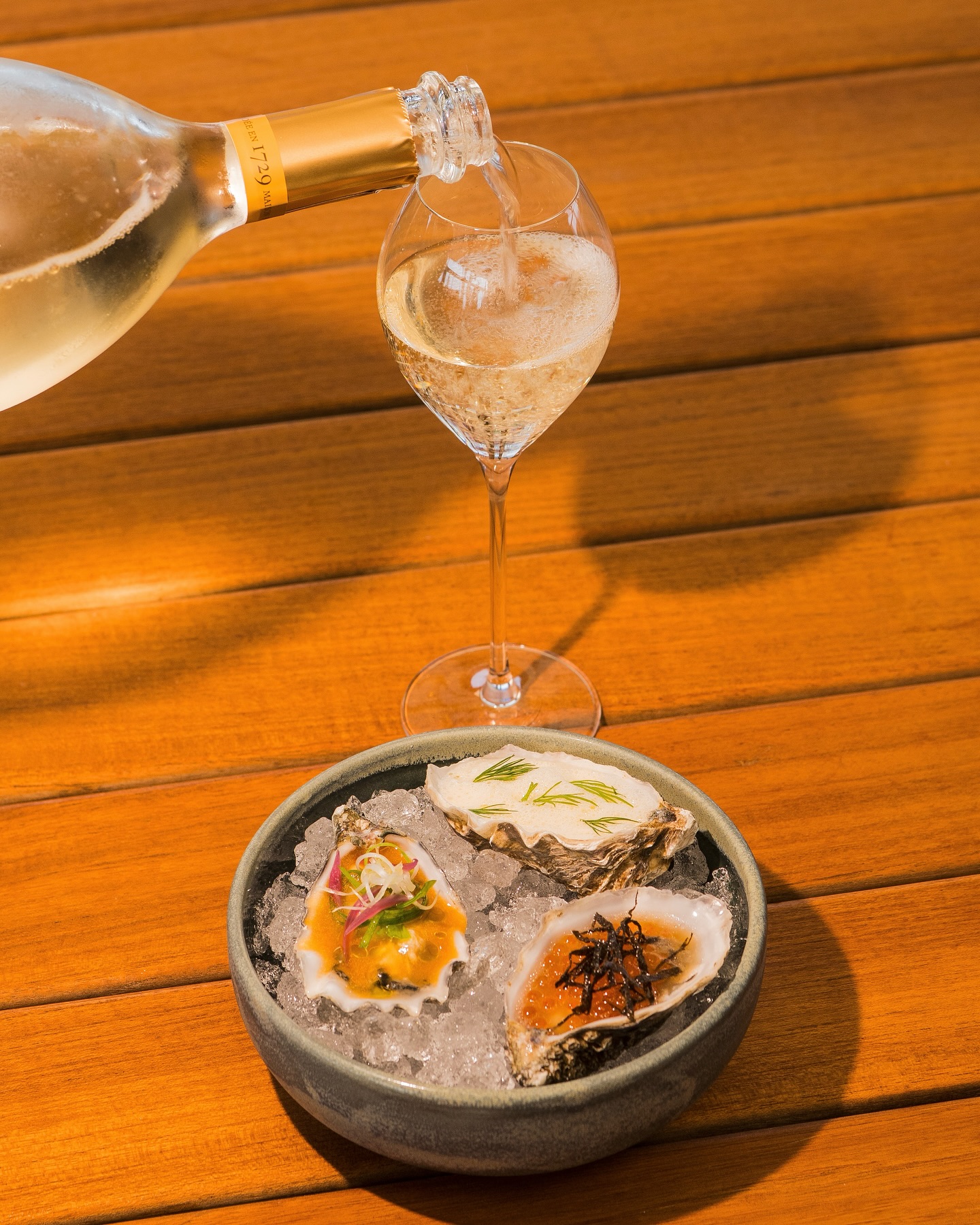 JULY’S PERFECT PAIRING 🦪🥂
This month, we’re serving a trio of oysters - each with a flavourful twist from different corners of the world:
🌿 The Nordic – horseradish beurre blanc & dill
🍅 The Mediterranean – tomato water, olive crumble & lemon
🌊 The Asian – yuzu dashi, trout roe & nori seaweed
All perfectly paired with a glass of Ruinart Brut – the iconic champagne from one of the world’s most prestigious maisons 🍾
Available every Wednesday in July✨